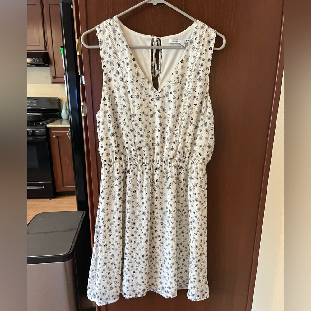 White A-Line V neck dress w/ blue & gold detail.